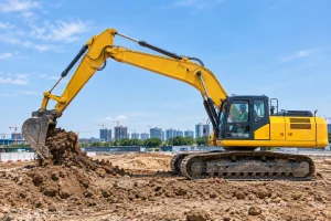 Excavator with boom, arm, and bucket extended showing the complete digging assembly
