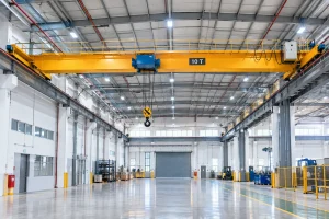 Overhead bridge crane operating inside an industrial facility